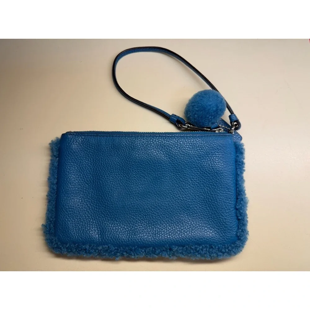 Coach Nolita Small Wristlet in Peacock Blue Pebble Leather with‎ Shearling Trim